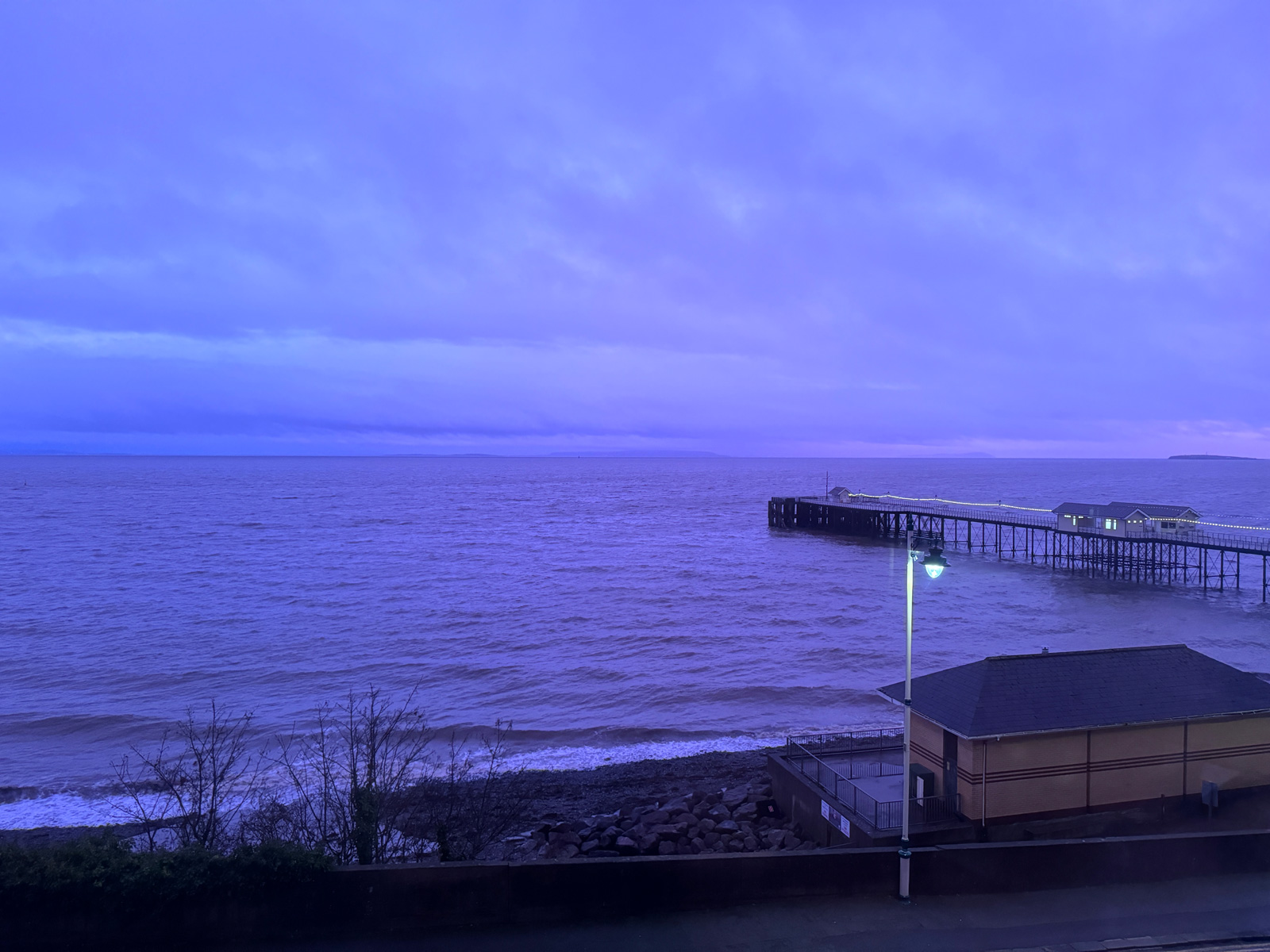 Penarth Pier and the Bristol Channel at purple dusk